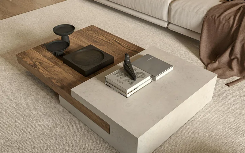 Elegant modern living room featuring a textured coffee table, cozy couch, and minimal decor.